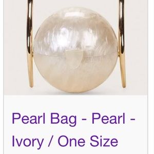 ORIGINAL!! New in box with tag peral top handle purse.